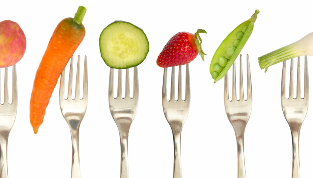 vegetables and fruits on the collection of forks, diet concept