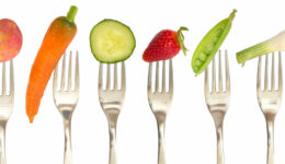 vegetables and fruits on the collection of forks, diet concept