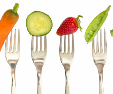 vegetables and fruits on the collection of forks, diet concept