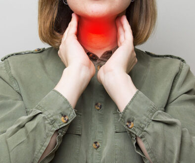 A Woman Holding Her Throat With A Red Highlight Showing Her Thyroid Glands Thyroid Eye Disease