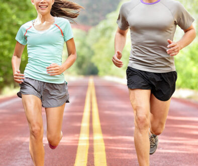 Closeup Of A Man And A Woman Running Outdoors On A Road Impact Of Running On Joint Health